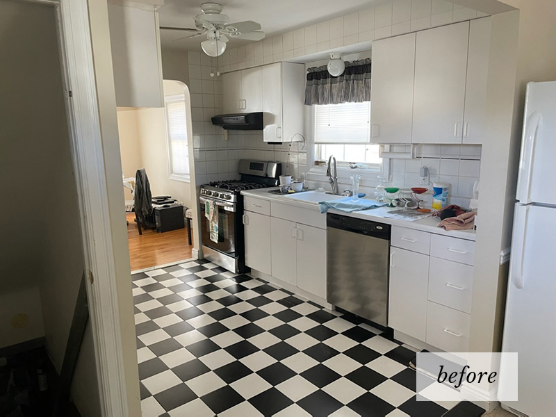 An outdated kitchen with a black and white checkered floor and an old style cabinets and countertop.